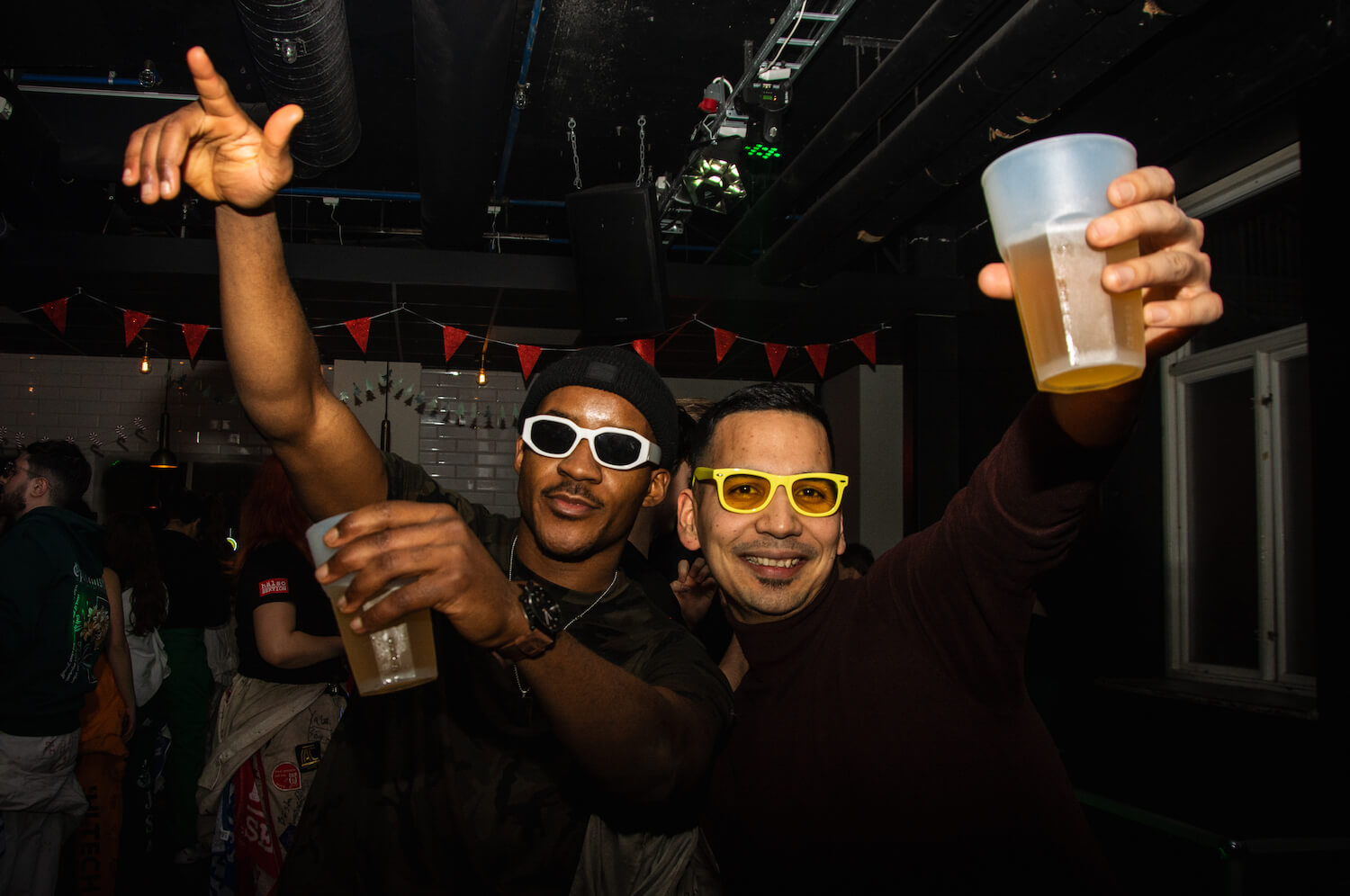 Cool guys with beer glass in their hands in Akademien Nightclub.